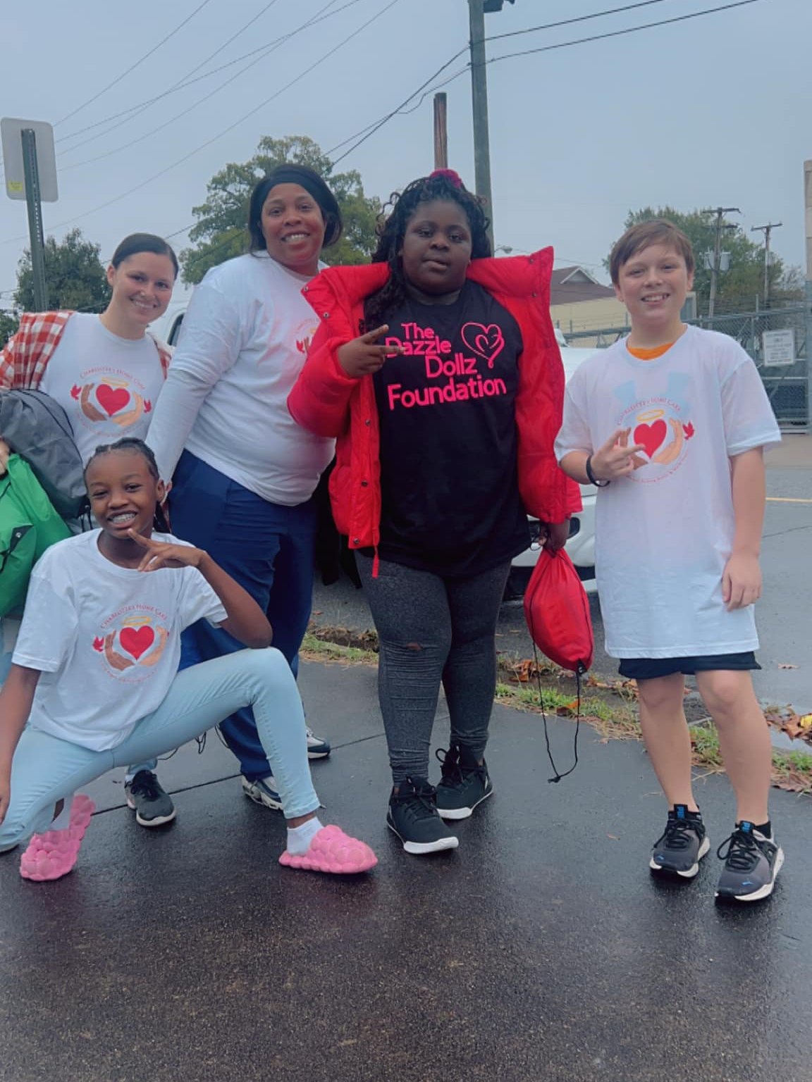 The Charlotte's Home Care team with young people at a community outreach event